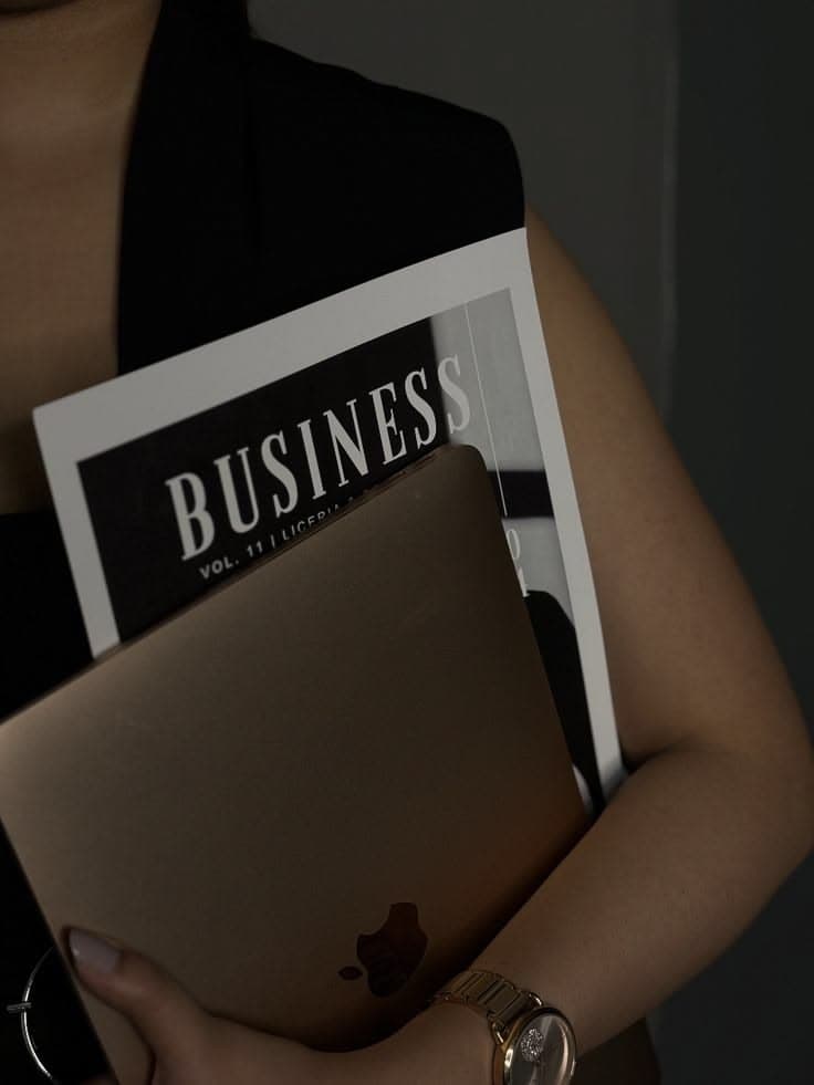 A founder holding a business magazine